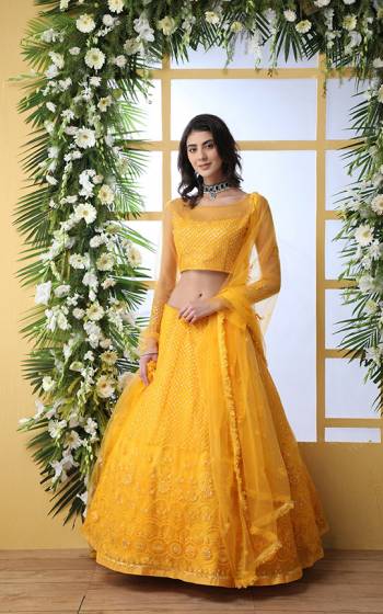 Look Pretty In This Beautiful Subtle Yellow Colored Heavy Designer Lehenga Choli. This Lehenga Choli IS Net Based Beautified With Heavy Yet Subtle Tone To Tone Embroidery. Buy This Lovely Piece Now.