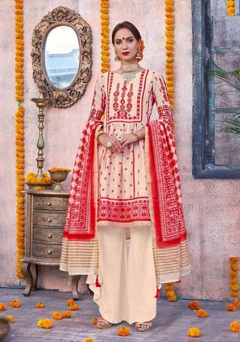 Flaunt Your Rich and Elegant Taste Wearing This Designer Suit In Cream And Red Color. Its Top Is Fabricated On Linen Paired With Cotton Fabricated Bottom And Chanderi Fabricated Dupatta. This Pretty Suit Is Suitable For Your Semi-Casuals Or Festive Wear. 