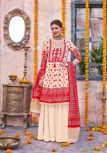 Flaunt Your Rich and Elegant Taste Wearing This Designer Suit In Cream And Red Color. Its Top Is Fabricated On Linen Paired With Cotton Fabricated Bottom And Chanderi Fabricated Dupatta. This Pretty Suit Is Suitable For Your Semi-Casuals Or Festive Wear. 