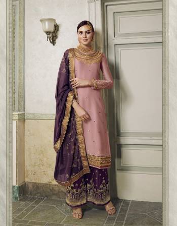 Get Ready For This Wedding And Festive Season With This Beautiful Designer Lehenga Or Plazzo Suit, You Can Get This Stitched In Either Of The Ways. This Pretty Suit Is In Pink Colored Top Paired With Contrasting Purple Colored Bottom And Dupatta. Its Top Is Fabricated On Satin Silk Paired With Jacquard Silk Bottom And Georgette Fabricated Stone Work Dupatta. Buy This Lovely Piece Now.