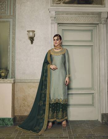 Here Is A Very Beautiful Designer Suit In Aqua Blue Colored Top Paired With Pine Green Colored Bottom And Dupatta. This Semi-Stitched Suit Can Be Made As Lehenga Suit Or Plazzo Suit, Either Way You Like. Its Top Is Fabricated On Satin Silk Beautified With Detailed Embroidery Paired With Jacquard Silk Fabricated Bottom And Georgette Fabricated Stone Work Dupatta. 