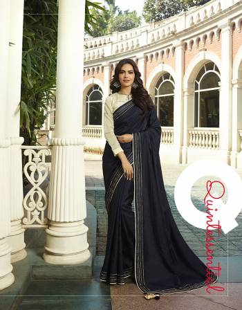 Enhance Your Personality Wearing This Designer Saree In Navy Blue Color Paired With Off-White Colored Blouse. This Saree And Blouse Are Silk Based Beautified With Minimal Thread Work. Buy Now.