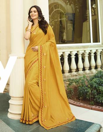 Celebrate This Festive Season With Beauty And Comfort Wearing This Rich And Elegant Looking Designer Saree In Musturd Yellow Color. This Saree And Blouse Are Silk Based Giving A Rich Look To Your Personality. 