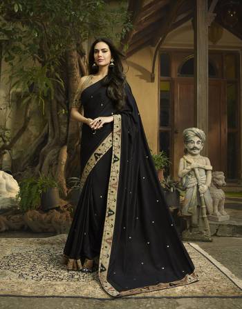 Celebrate This Festive Season With Beauty And Comfort Wearing This Rich And Elegant Looking Designer Saree In Black Color. This Saree And Blouse Are Silk Based Giving A Rich Look To Your Personality. 