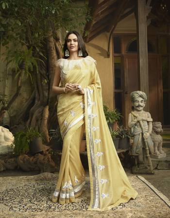 You Will Definitely Earn Lots Of Compliments Wearing This lovely Designer Saree In Yellow Color Paired With Cream Colored Blouse. This Saree And Blouse Are Silk Based With Pretty Elegant Embroidery. Buy Now.