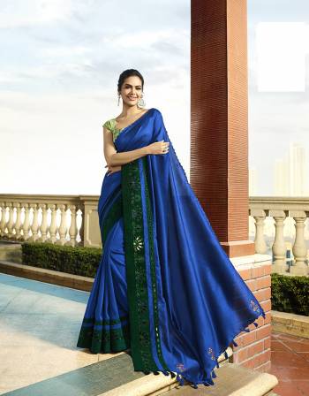 Enhance Your Personality Wearing This Designer Saree In Royal Blue Color Paired With Light Green Colored Blouse. This Saree And Blouse Are Silk Based Beautified With Minimal Thread Work. Buy Now.