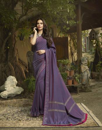 Shine Bright Wearing This Attractive Designer Saree In Purple Color Paired With Grey Colored Blouse. This Saree And Blouse Are Silk Based With Deatiled Thread Work. 