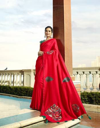 You Will Definitely Earn Lots Of Compliments Wearing This lovely Designer Saree In Red Color Paired With Turquoise Blue Colored Blouse. This Saree And Blouse Are Silk Based With Pretty Elegant Patch Work. Buy Now.