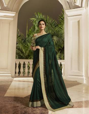 Enhance Your Personality Wearing This Designer Saree In Pine Green Color Paired With Light Green Colored Blouse. This Saree And Blouse Are Silk Based Beautified With Minimal Thread Work. Buy Now.