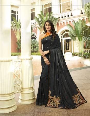 Celebrate This Festive Season With Beauty And Comfort Wearing This Rich And Elegant Looking Designer Saree In Black Color. This Saree And Blouse Are Silk Based Giving A Rich Look To Your Personality. 