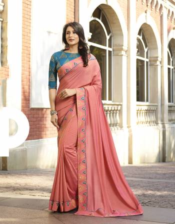 Shine Bright Wearing This Attractive Designer Saree In Pink Color Paired With Blue Colored Blouse. This Saree And Blouse Are Silk Based With Deatiled Thread Work And Foil Print. 