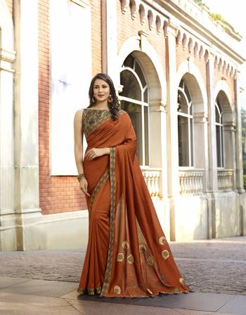 You Will Definitely Earn Lots Of Compliments Wearing This lovely Designer Saree In Rust Orange Color Paired With Cream Colored Blouse. This Saree And Blouse Are Silk Based With Pretty Elegant Thread Work. Buy Now.