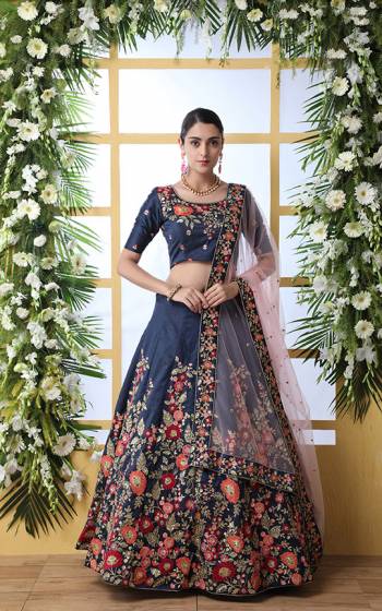 Enhance Your Personality Wearing This Designer Heavy Lehenga Choli In Navy Blue Color Paired With Contrasting Baby Pink Colored Dupatta. This Pretty Lehenga Choli IS Fabricated on Art Silk Beautified With Contrasting Threads And Jari Embroidery With Sequence Work, Paired With A Pretty Net Fabricated Dupatta. 