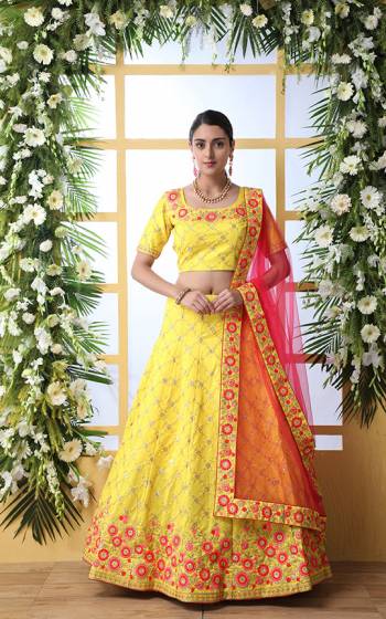 Attract All Wearing This Heavy Designer Lehenga Choli In Yellow Color Paired With Contrasting Rani Pink Colored Dupatta. This Pretty Attractive Lehenga Choli Is Silk based Paired With net Fabricated Dupatta. Buy This Bright Colored Lehenga Choli Now.