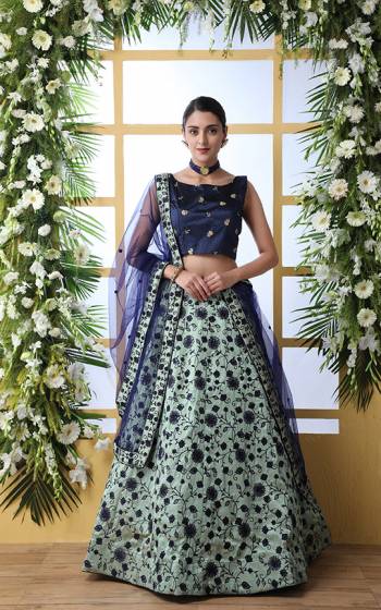 Go With The Lovely Shades Of Blue Wearing This Designer Lehenga Choli In Royal Blue Colored Blouse Paired with Aqua Blue Colored Lehenga And Royal Blue Colored Dupatta. Its blouse And lehenga Are Fabricated On Art Silk Paired With Net Fabricated Dupatta. 