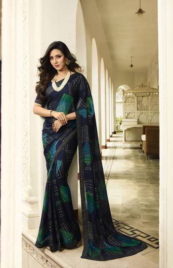 Here Is A Pretty Printed Saree For Your Semi-Casuals In Navy Blue Color. This Saree Is Fabricated On Georgette Paired With Art Silk Fabricated Blouse. It Is light In Weight And Easy To Drape. Buy This pretty Saree Now.