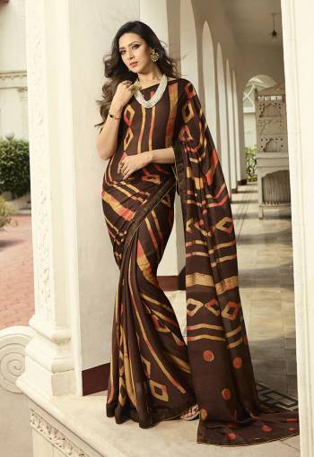 Here Is A Pretty Printed Saree For Your Semi-Casuals In Brown Color. This Saree Is Fabricated On Georgette Paired With Art Silk Fabricated Blouse. It Is light In Weight And Easy To Drape. Buy This pretty Saree Now.