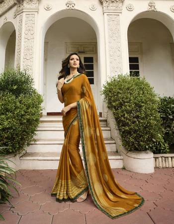 For Your Semi-Casual Wear, Grab This Pretty Saree In Musturd Yellow Color. This Printed Saree Is Fabricated On Georgette Paired With Art Silk Fabricated Blouse. Its Fabric Is Durable And Easy To Care For. 