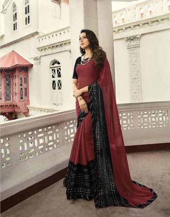 Here Is A Pretty Printed Saree For Your Semi-Casuals In Maroon Color. This Saree Is Fabricated On Georgette Paired With Art Silk Fabricated Blouse. It Is light In Weight And Easy To Drape. Buy This pretty Saree Now.