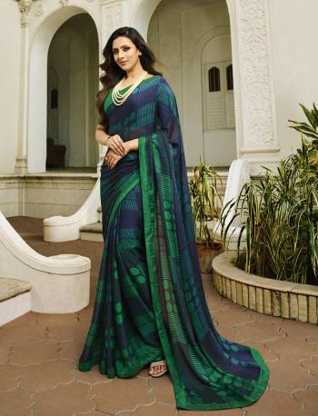 For Your Semi-Casual Wear, Grab This Pretty Saree In Navy Blue. This Printed Saree Is Fabricated On Georgette Paired With Art Silk Fabricated Blouse. Its Fabric Is Durable And Easy To Care For. 