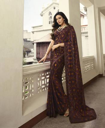 For Your Semi-Casual Wear, Grab This Pretty Saree In Wine Color. This Printed Saree Is Fabricated On Georgette Paired With Art Silk Fabricated Blouse. Its Fabric Is Durable And Easy To Care For. 