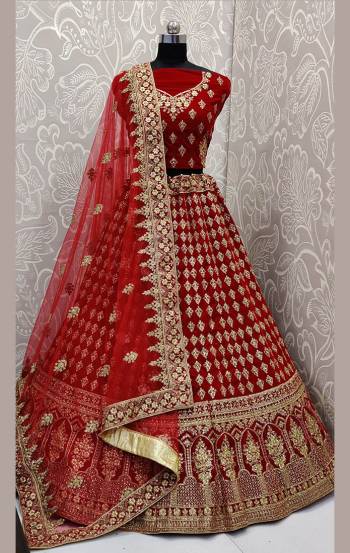 Here Is A Beautiful Designer Bridal Lehenga Choli In Red Color Paired With Red Colored Dupatta. This Beautiful Heavy Lehenga Choli Is Fabricated On Velvet Paired With Net Fabricated Dupatta. It Is Beautified With Heavy Detailed Embroidery. Get Ready For Your D-Day With This Designer Piece And Look The Most Graceful Of All