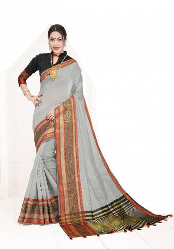Enhance Your Personality Wearing This Silk Based Saree In Grey Color Paired With Black Colored Blouse. This Pretty Weaved Saree Is Fabricated On Cotton Silk Paired With Art Silk Fabricated Blouse. Buy Now