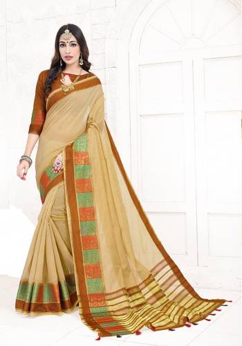 Flaunt Your Rich And Elegant Taste Wearing This Lovely Silk Based Saree In Beige Color Paired With Contrasting Brown Colored Blouse. This Saree Is Fabricated On Cotton Silk Paired With Art Silk Fabricated Blouse Beautified With Weave. Buy Now