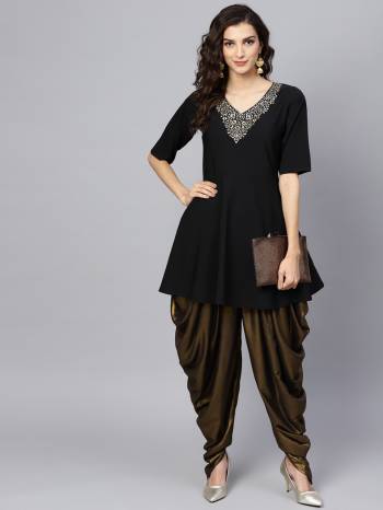 Here Is Lovely Indo Western pair In Black Colored Peplum Top Paired With Copper Colored Dhoti. Its Top Is Fabricated On Crepe Paired With Georgette Fabricated Dhoti. Buy This Readymade Pair Now.