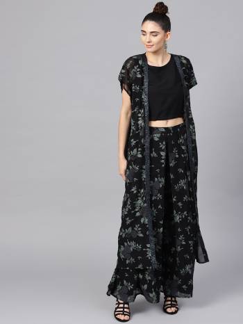 Another Lovely Indo-Western Pair Is Here In All Over Black Color. Its Top Is Fabricated Crepe Paired With Georgette Fabricated Bottom And Shrug. It Is Beautified With Prints And Its Fabric Is Light Weight And Esnures Superb Comfort All Day Long. 