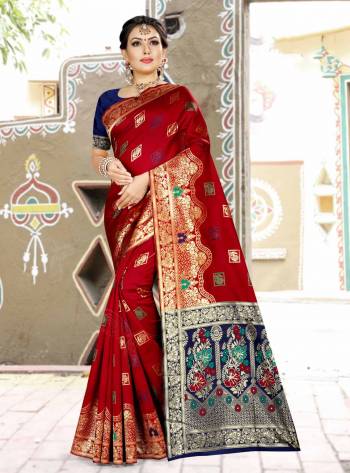 Grab This Designer Silk Based Saree In Red Color Paired With Contrasting Navy Blue Colored Blouse. This Saree And Blouse Are Fabricated On Banarasi Art Silk Beautified With Weave All Over. Buy Now.