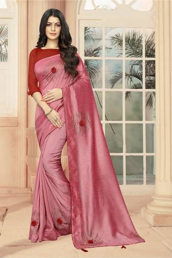 Celebrate This Festive Season With Beauty And Comfort Wearing This Lovely And Elegant Looking Deisgner Saree In Pink Color Paired With Red Colored Blouse. This Saree And Blouse are Silk Based Beautified With 3D Flowers And Stone Work. 