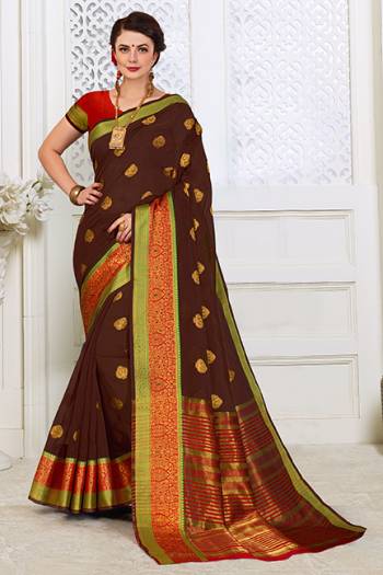 For A Proper Traditonal Look, Grab This Saree In Brown Color Paired With Contrasting Red Colored Blouse. This Saree Is Fabricated on Cotton Silk Paired With Art Silk Fabricated Blouse.