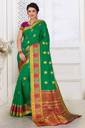 Celebrate This Festive Season With Beauty And Comfort In This Lovely Green Color Saree Paired With Contrasting Magenta Pink Colored Blouse. This Saree Is Cotton Silk Based Paired with Art Silk Fabricated Blouse. Buy This Lovely Weaved Saree Now.