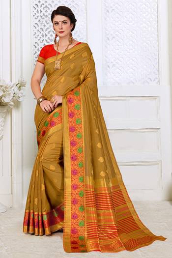 For A Proper Traditonal Look, Grab This Saree In Beige Color Paired With Contrasting Red Colored Blouse. This Saree Is Fabricated on Cotton Silk Paired With Art Silk Fabricated Blouse.