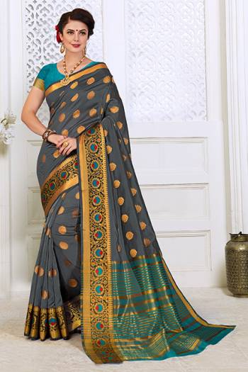 Here Is A Very Pretty Designer Silk based Saree In Dark Grey Color Paired With Contrasting Blue Colored Blouse . This Lovely Weaved Saree Is Fabricated On Cotton Silk Paired With Art Silk Fabricated Blouse. It Is Light Weight, Durable And Easy To Carry All Day Long. 