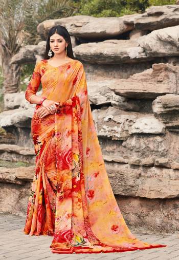 Go Colorful With This Lovely Printed Saree In Orange And Red Color. This Pretty Saree And Blouse Are Fabricated On Chiffon. It Is Light In Weight And Easy To Carry All Day Long. 