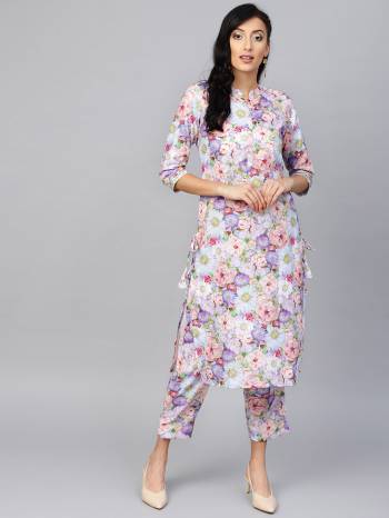 Go Colorful With This Pretty Readymade Kurti And Pant In Multi Color. This Beautiful Pair Is Fabricated On Rayon Beautified With Floral Prints All over It. 