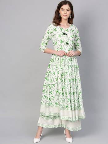 For Your Casual Or Semi-Casual Wear, Grab This Readymade Pair Of Kurti Set In White And Green. This Readymade Set IS Fabricated On Rayon Beautified With Prints. Its Fabric Is Cool And Ensures Superb Comfort all Day Long. 