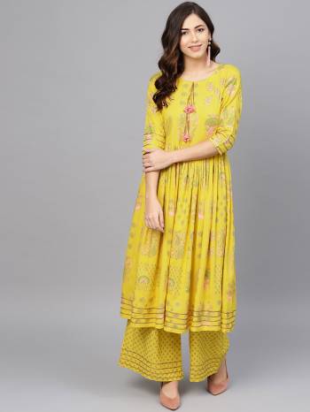 For Your Casual Or Semi-Casual Wear, Grab This Readymade Pair Of Kurti Set In Yellow This Readymade Set IS Fabricated On Rayon Beautified With Prints. Its Fabric Is Cool And Ensures Superb Comfort all Day Long. 