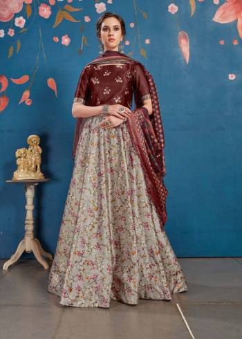 Go Colorful With This Lovely Designer Lehenga Choli In Maroon Colored Blouse Paired With Contrasting Grey Colored lehenga And Maroon Colored Dupatta. Its Blouse And Lehenga Are Fabricated On Art Silk Paired With Tussar Art Silk Fabricated Dupatta. It Is Beautified With Lovely Digital Prints. Buy Now.