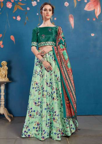 Go Colorful With This Lovely Designer Lehenga Choli In Teal Green Colored Blouse Paired With Contrasting Light Green Colored lehenga And Teal Green Colored Dupatta. Its Blouse And Lehenga Are Fabricated On Art Silk Paired With Tussar Art Silk Fabricated Dupatta. It Is Beautified With Lovely Digital Prints. Buy Now.