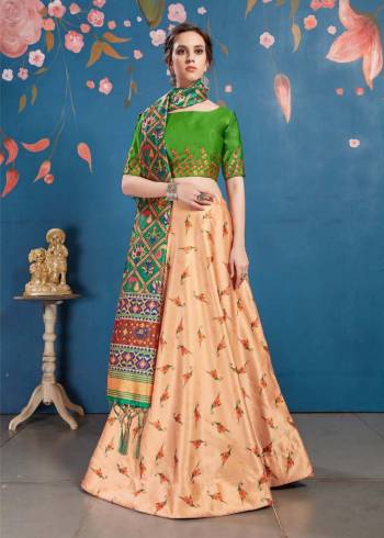 For The Upcoming Festive And Wedding Season, Here Is A Perfect Designer Lehenga Choli In Parrot Green Colored Blouse Paired With Light Orange Colored Lehenga And Green Colored Dupatta. This Lehenga Choli Is Silk Based Paired With Tussar Art Silk Fabricated Dupatta. It Pretty Digital Prints Will Earn You Lots Of Compliments From onlookers. 