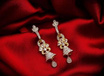 Here Is A Very Pretty Pair Of Simple And Elegant Looking Earring?Set In Golden Color. It Has Pretty Unique pattern With Attractive Diamond Work. You can Pair This Even With Simple Attire As Well As A Heavy One. This Pretty Evergreen Design Compliments Any Kind Of Attire You Wear.