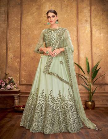 This ornately embroidered lehenga is a rhythmic and modern approach to conventional designs. Embedded with delicate floral details and a touch of metallic thread, this lehenga emits magnificence. 