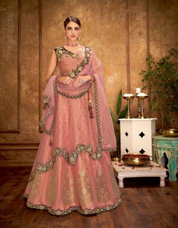 This gorgeous weaved silk double-layered lehenga is a  vintage-inspired design that grows prettier with time. Everytime you wear it , its bound to give the old-world charm a new meaning. 