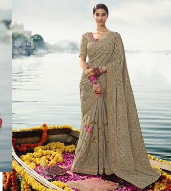 Flaunt Your Rich And Elegant Taste Wearing This Subtle Rich Grey Colored Heavy Designer Saree. This Saree And Blouse Are Fabricated On Chinon Beautified Heavy Tone To Tone And Contrasting Embroidery. Buy This Lovely Saree Now.