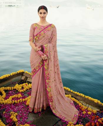Flaunt Your Rich And Elegant Taste Wearing This Subtle Rich Baby Pink Colored Heavy Designer Saree. This Saree And Blouse Are Fabricated On Chinon Beautified Heavy Tone To Tone And Contrasting Embroidery. Buy This Lovely Saree Now.