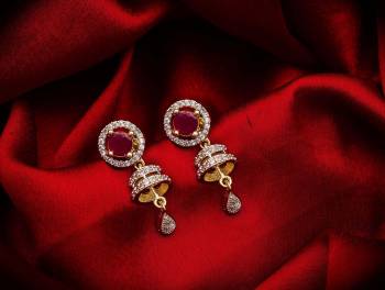 Here Is A Very Pretty Pair Of Simple And Elegant Looking Earring?Set In Golden Color. It Has Pretty Unique pattern With Attractive Diamond Work. You can Pair This Even With Simple Attire As Well As A Heavy One. This Pretty Evergreen Design Compliments Any Kind Of Attire You Wear.