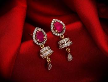 Here Is A Very Pretty Pair Of Simple And Elegant Looking Earring?Set In Golden Color. It Has Pretty Unique pattern With Attractive Diamond Work. You can Pair This Even With Simple Attire As Well As A Heavy One. This Pretty Evergreen Design Compliments Any Kind Of Attire You Wear.